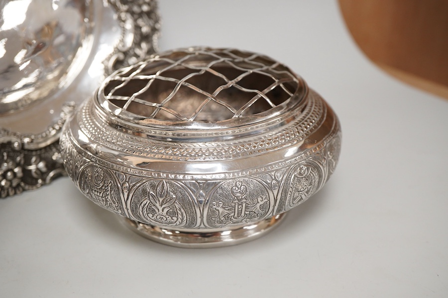 Two Indian white metal rose bowls, one octagonal with stand, diameter 12.5cm, together with a small white metal stand, with foliate border.